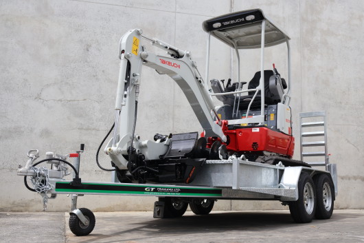 Takeuchi TB217R on a trailer Tilt and Spade Bucket